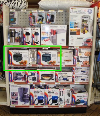 A display of RoadPro products with the RoadPro Portable Stove highlighted in a red box.