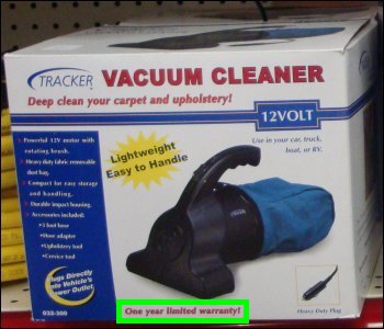 12-volt vacuum cleaner with a one year limited warranty for sale at a truck stop.