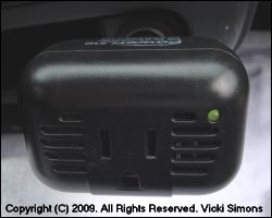 12-volt inverter plugged in, green indicator light