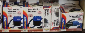 Hand held vacuum cleaners for sale at a truck stop.