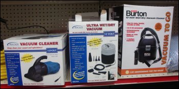 Hand held vacuum cleaners for sale at a truck stop.