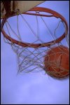 shooting a basketball through a hoop