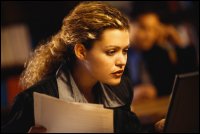 Woman looking at computer as though trying to understand.