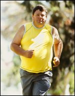 Overweight man exercising by running or power walking.