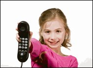 Little girl holding out phone.