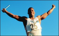 Man winning a relay race with baton in hand; victory