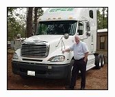 Mike Simons in front of Epes Transport tractor