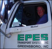 Mike Simons shown sitting in a truck he once drove professionally.