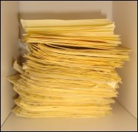 Stack of yellow sticky notes with Scripture verses and 'I love you!' that Vicki wrote for Mike as a means of positive encouragement.