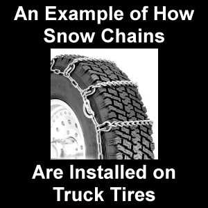 An example of how snow chains are installed on truck tires.