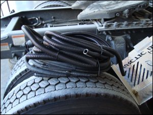 Tubing and wiring for Arctic Breeze on tractor drive tires.