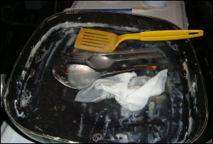 We used our electric skillet as a mini sink and a baby wipe as a disposable dishcloth.