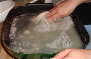 Vicki is cleaning the electric skillet after all of the other dishes used at that meal have been washed.