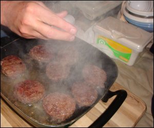 The box of baby wipes was always close by when we cooked in our truck. Here, it is really close by when Mike cooked hamburgers.