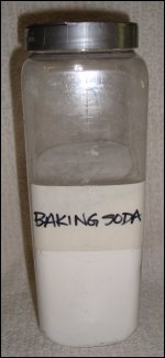 Baking soda in a plastic container with lid.