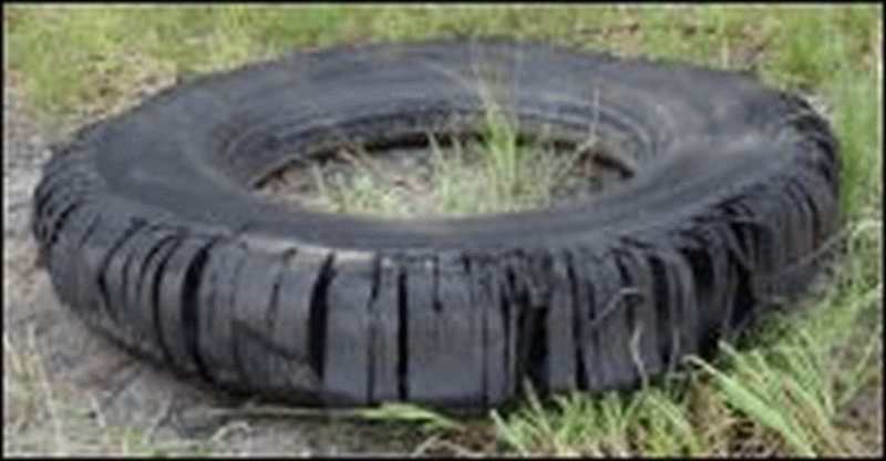 A blown tire from a commercial motor vehicle or semi tractor trailer.