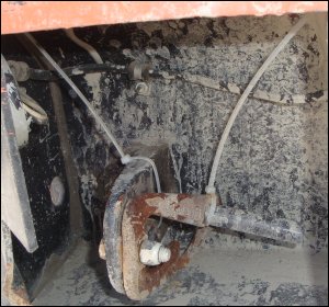 Two cable ties anchoring the tie downs on a container chassis.