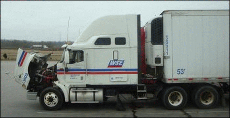 Professional truck driver on his cell phone in his parked truck.