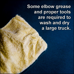 Some elbow grease and proper tools are required to wash and dry a large truck.