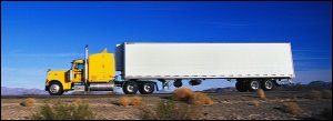 Yellow semi truck with refrigerated van.