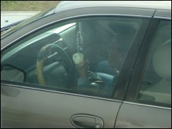 A distracted driver of a passenger car.