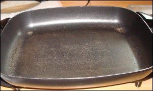 electric skillet showing peeling non-stick coating