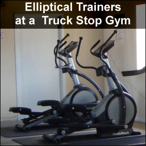 Elliptical trainers at a truck stop gym.