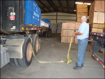 Surveying the flatbed load, where load straps have to be placed.