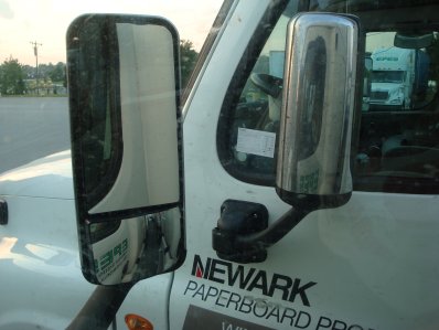 Two truck mirrors near each other. Both can be folded in. One is folded in.