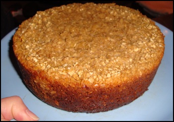 A view of the side of the crock pot-prepared Amish Baked Oatmeal loaf, to show how deep it is.