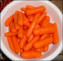 Baby carrots, ready to be added to the crock pot for beef stew.