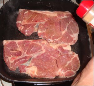 Cooking pork steak.