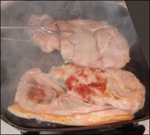 Cooking pork steak.