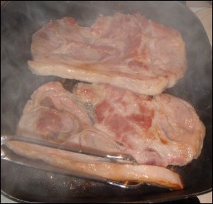 Cooking pork steak.