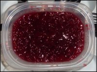 A close-up view of whole berry cranberry sauce.