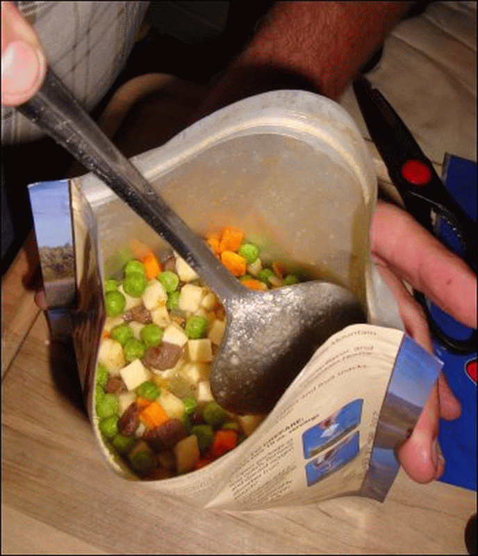 Mike carefully stirred the freeze dried beef stew once the boiling water had been added to the pouch.