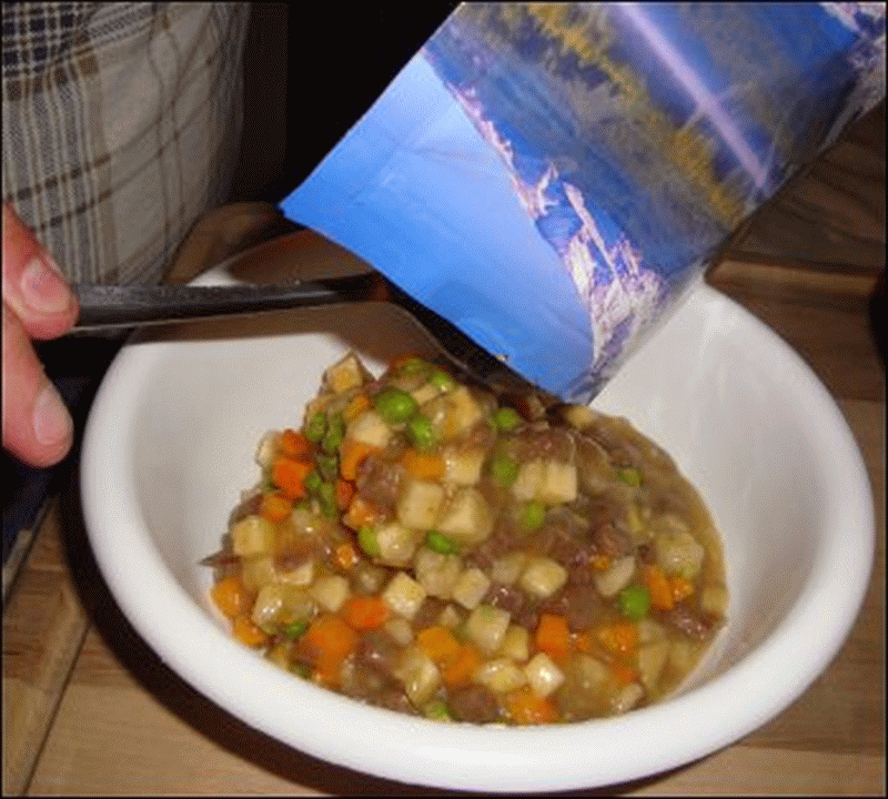 Mike scooped the beef stew into a bowl.