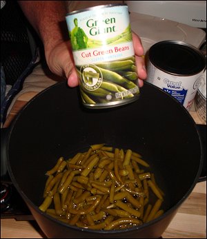 Contents of a can of green beans cooking.