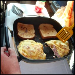 Cooking bread and ham and cheese omelette in an electric skillet in an 18-wheeler.