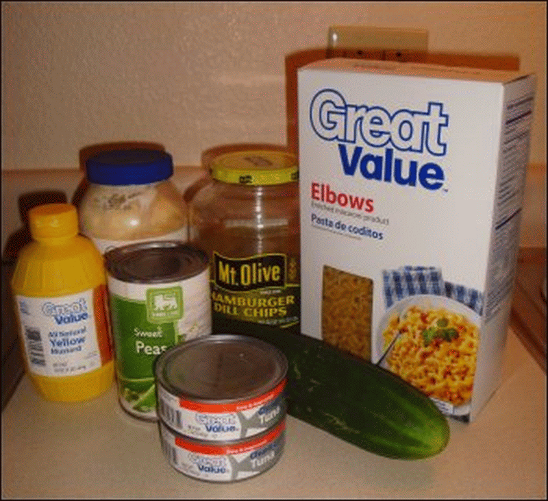 Ingredients for mean pea salad, a cool pasta salad with tuna, peas, pickles and cucumber.