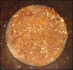 How the peach crisp looks in the crock pot at the end of the cooking cycle.