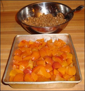 Peaches in the pan with blended oatmeal mixture in the back.