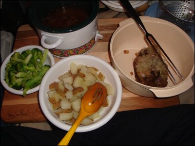 The complete cooked meal consisted of steamed broccoli (left), boiled potatoes (center), pot roast (right) and au jus with onion (top, in the crock pot).