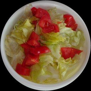 A lettuce and tomato salad with no dressing.