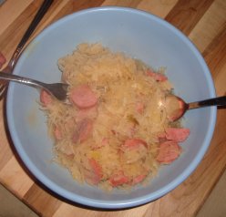 Heated up polish sausage and sauerkraut.