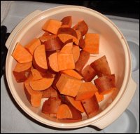 Cleaned and cut up sweet potatoes, waiting to be boiled and prepared into sweet potato casserole.