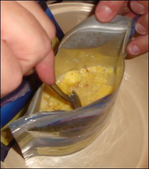 Stirring up the contents after boiling water is poured in.