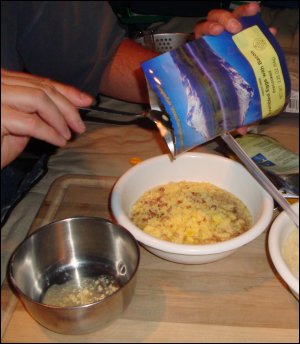 Pouring the rehydrated freeze dried eggs into a bowl.