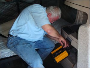 With the movement of the battery bank, the inverter had to be moved from under the bunk to the storage area behind the driver's seat