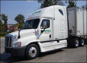 Profile of Freightliner Cascadia showing lower set folding mirrors